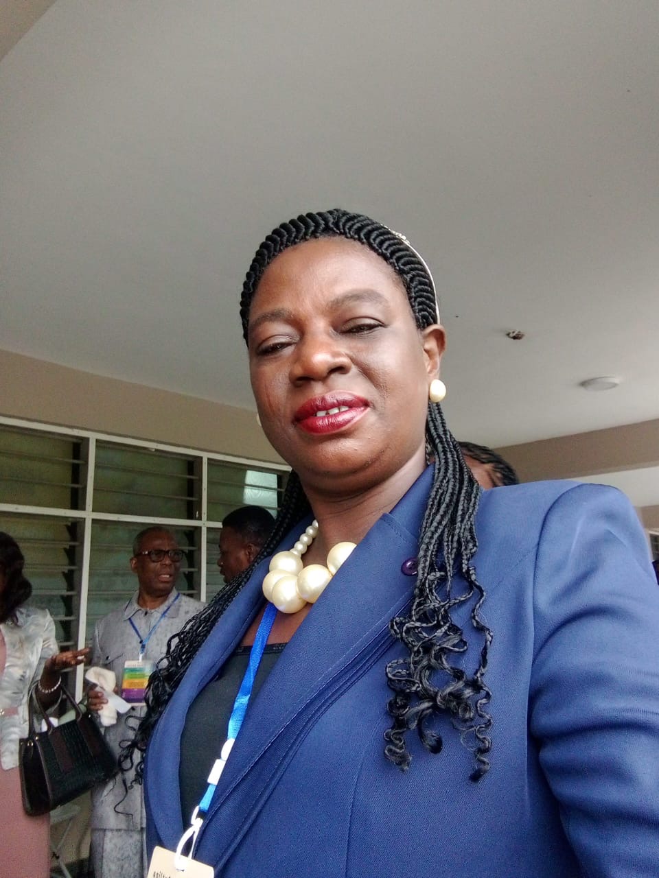 Rev. Helena Ramatu Abdulai attending a gathering in a blue suit