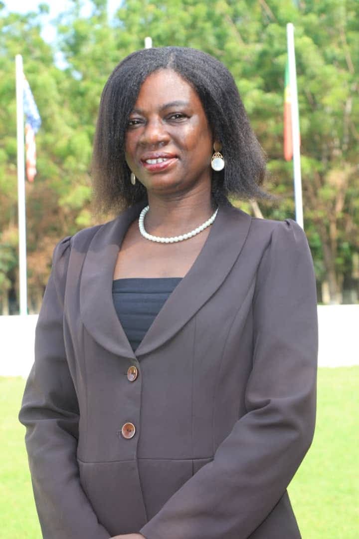 Rev. Helena Ramatu Abdulai wearing a grey suit and pearl necklace